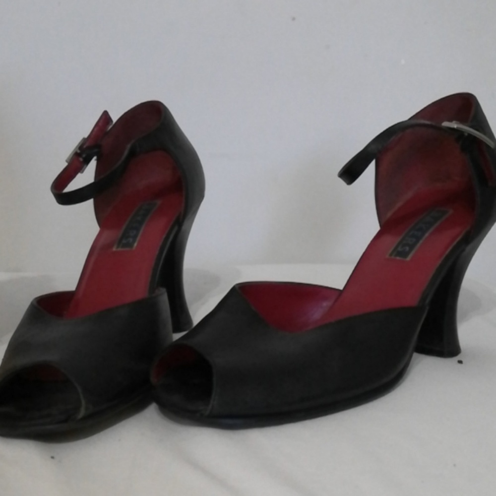 Black. Ankle strap heels.
